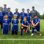 Steve Moubray and Rik Popat coaching youth soccer